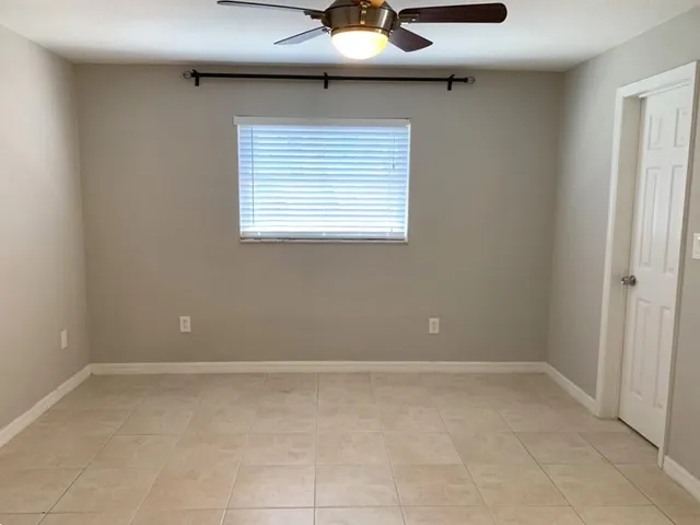 a view of an empty room with a window