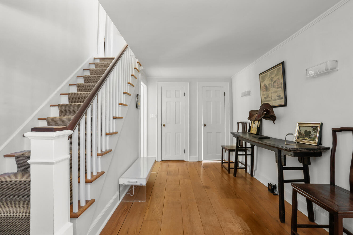 427 Eden Road Stamford, CT 06907 - Photo 2 of 40 a view of a hallway with wooden floor and staircase