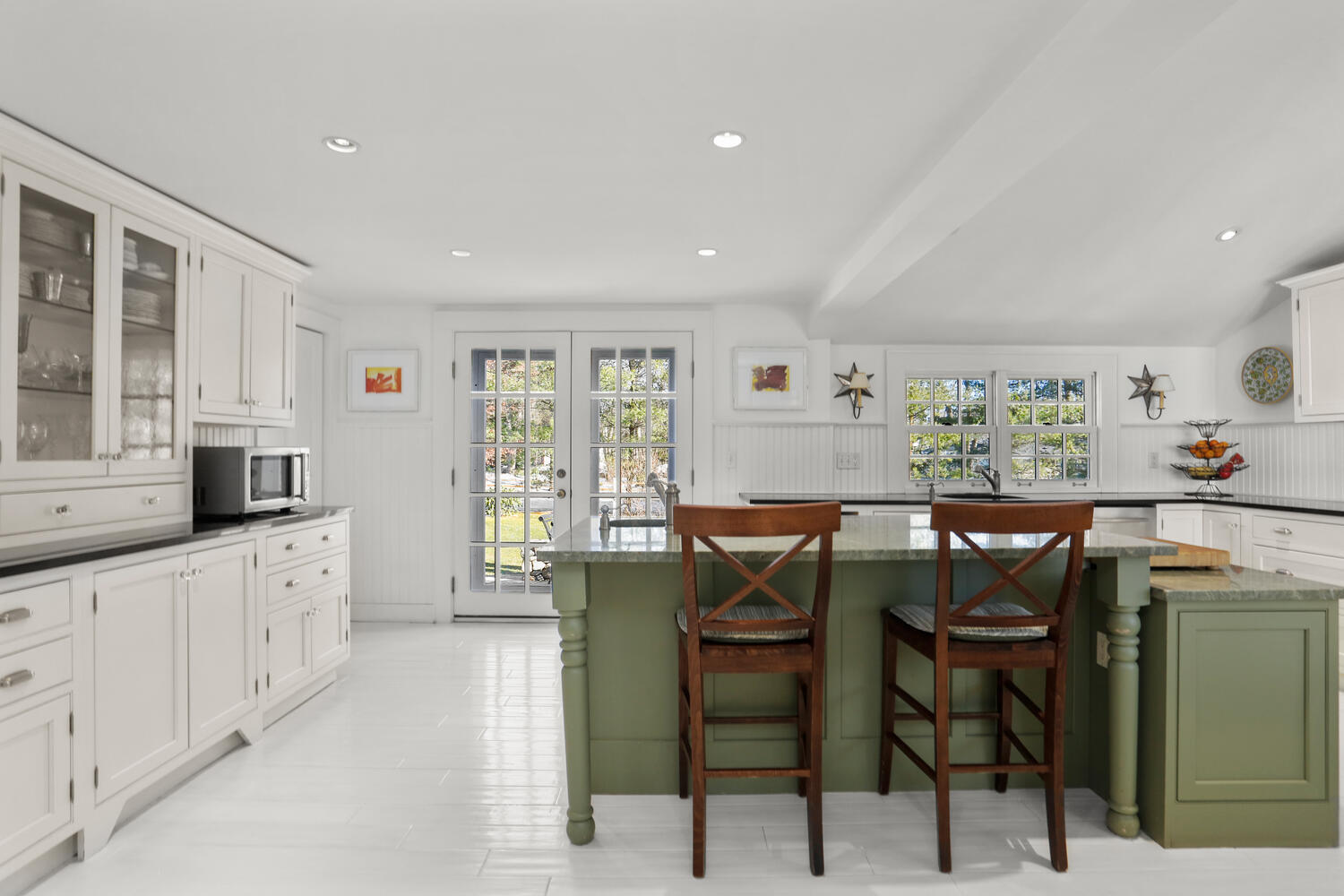 427 Eden Road Stamford, CT 06907 - Photo 6 of 40 a kitchen with stainless steel appliances a table and chairs in it