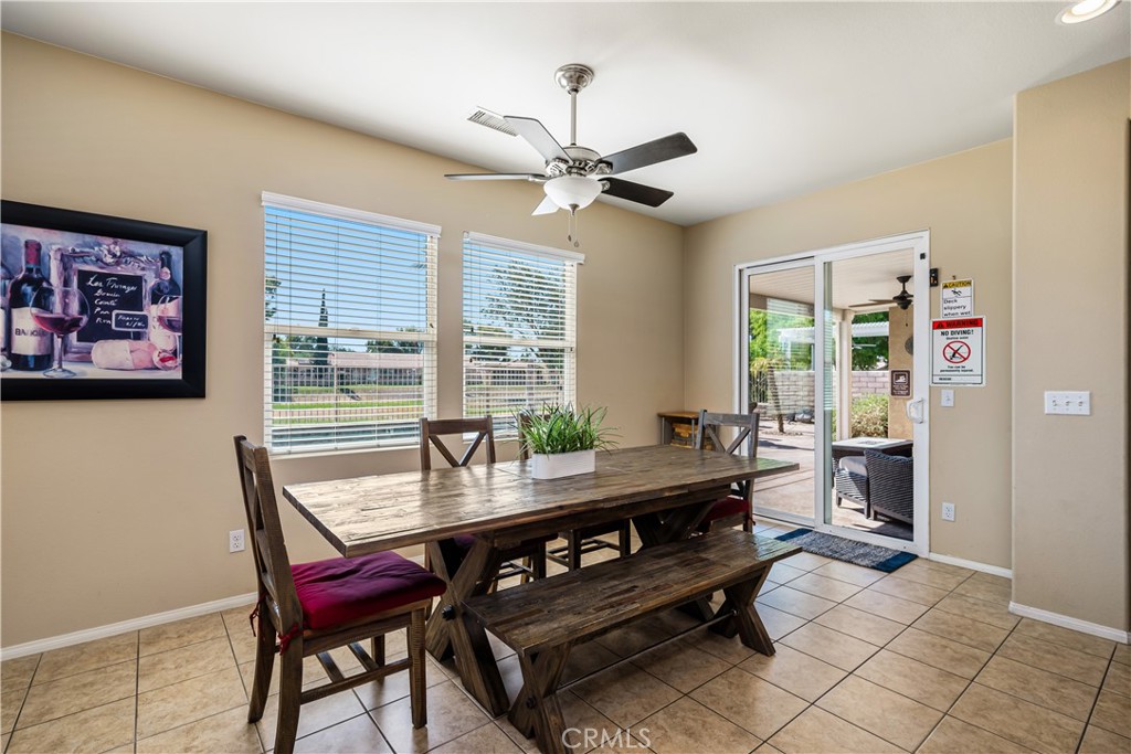 49267 Biery Street Indio, CA 92201 - Photo 11 of 28 a dining room with furniture and window