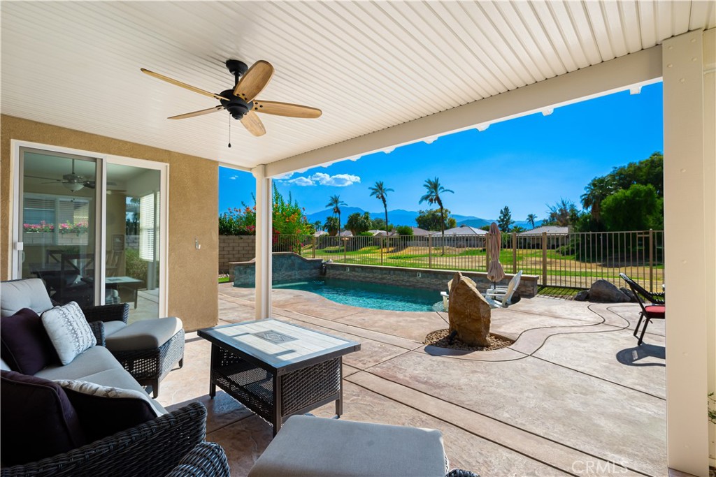 49267 Biery Street Indio, CA 92201 - Photo 13 of 28 a view of a swimming pool with a patio