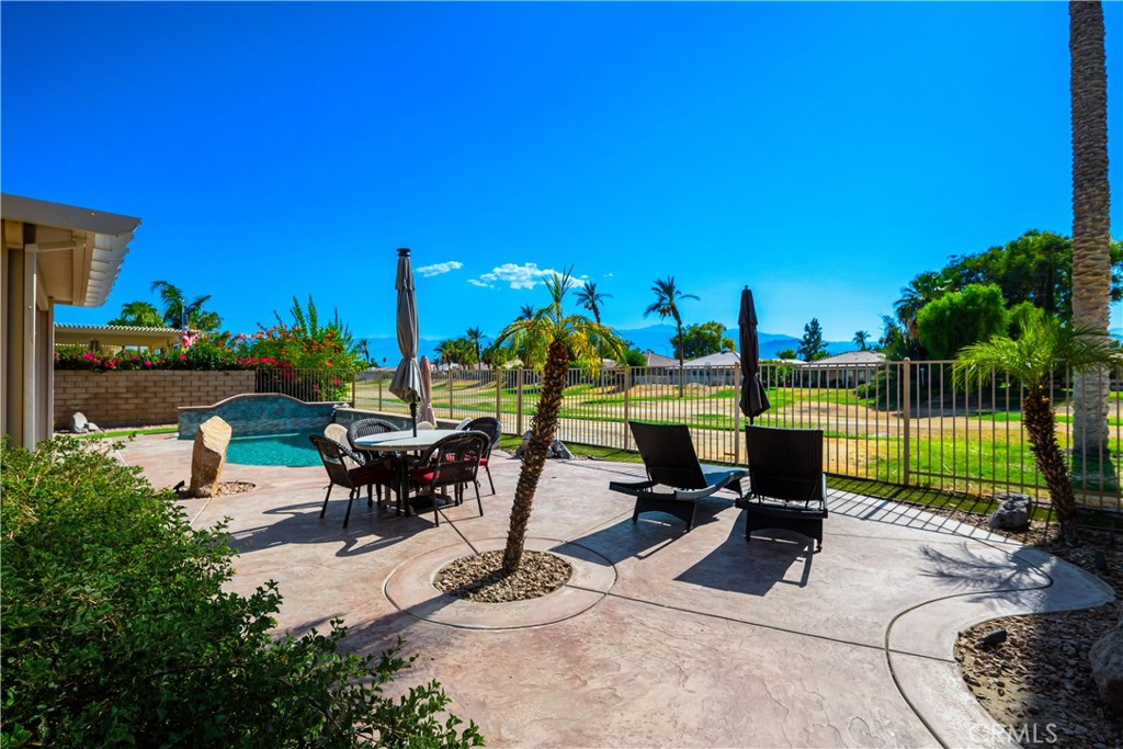 49267 Biery Street Indio, CA 92201 - Photo 17 of 28 a view of a backyard with sitting area
