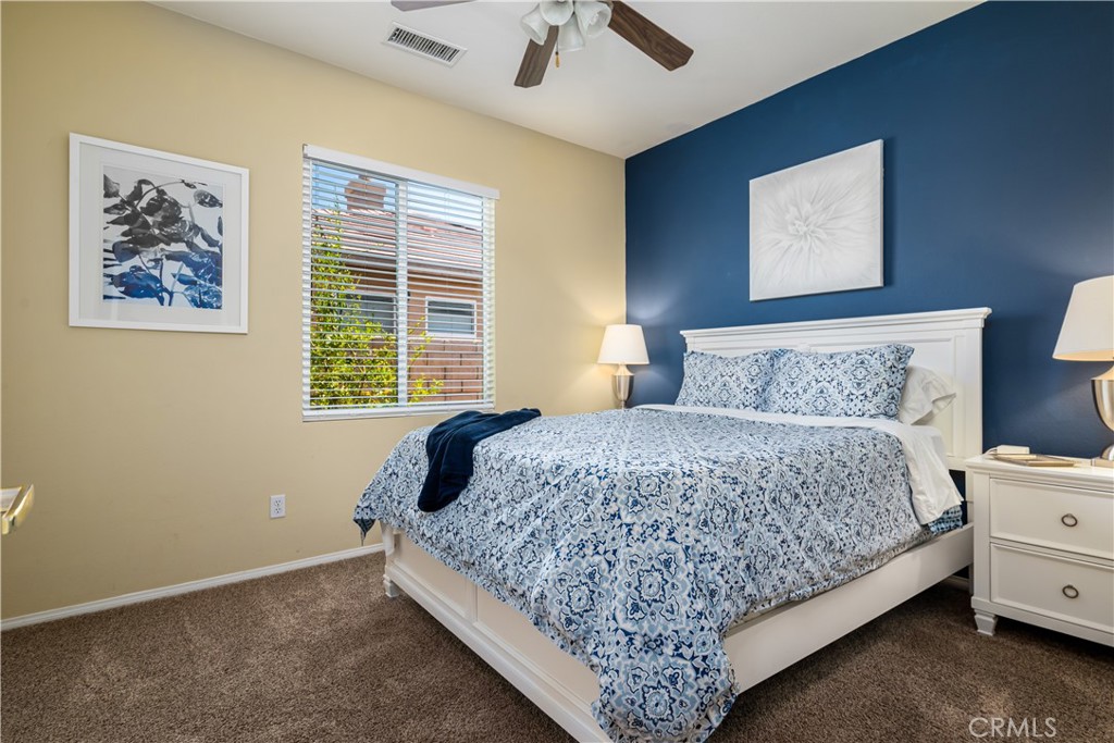 49267 Biery Street Indio, CA 92201 - Photo 20 of 28 a bedroom with a bed and a window