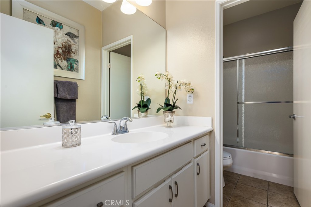 49267 Biery Street Indio, CA 92201 - Photo 22 of 28 a bathroom with a sink and a mirror