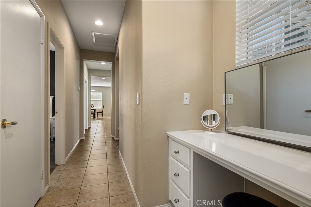 49267 Biery Street Indio, CA 92201 - Photo 23 of 28 a bathroom with a sink and a mirror