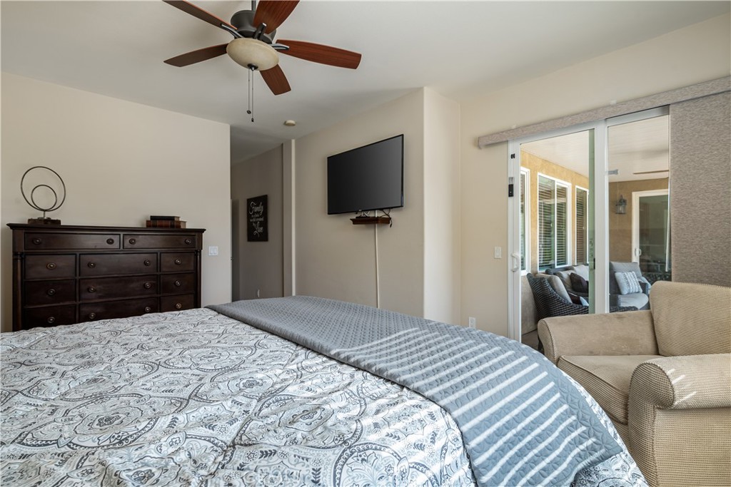 49267 Biery Street Indio, CA 92201 - Photo 26 of 28 a bedroom with a bed and a flat screen tv