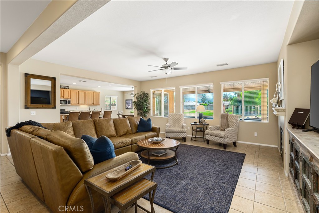 49267 Biery Street Indio, CA 92201 - Photo 3 of 28 a living room with furniture and a flat screen tv