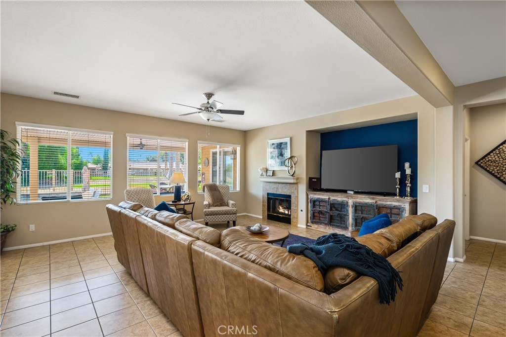 49267 Biery Street Indio, CA 92201 - Photo 4 of 28 a living room with furniture and a flat screen tv