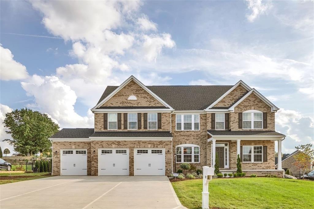 1102 Blackthorne Drive Jeannette, PA 15644 - Photo 1 of 25 a front view of a house with a yard