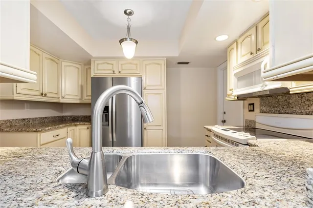 a view of a kitchen counter space and wooden floor