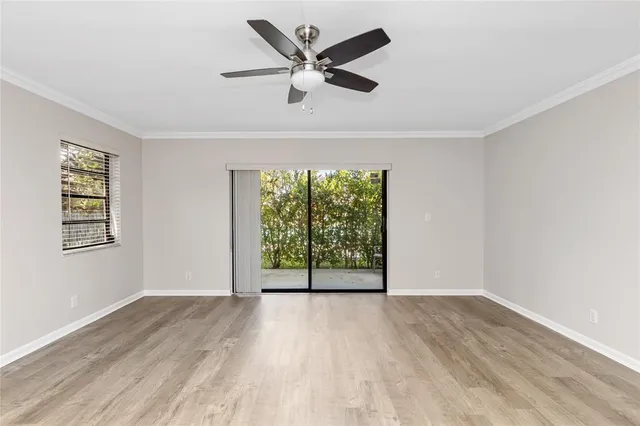 wooden floor in an empty room with a window