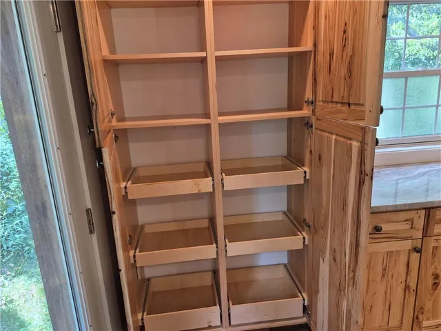 a view of walk in closet with window