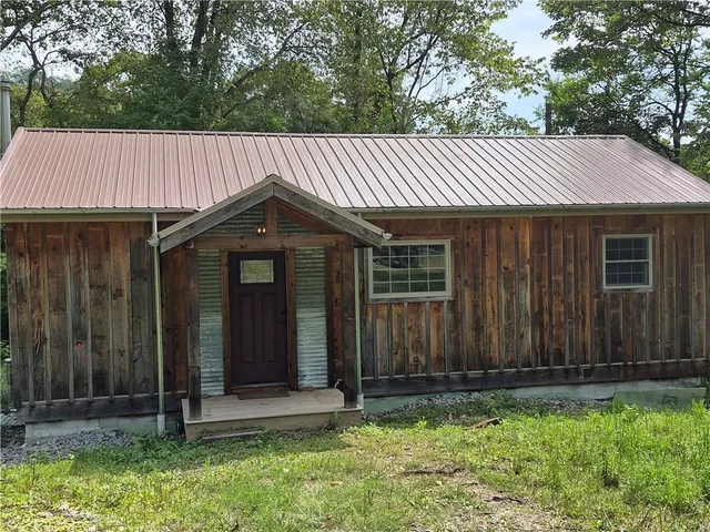 a front view of a house having yard