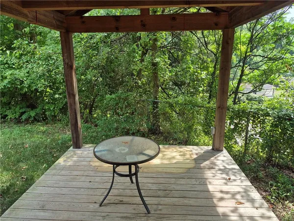 a view of a chairs and table in the garden