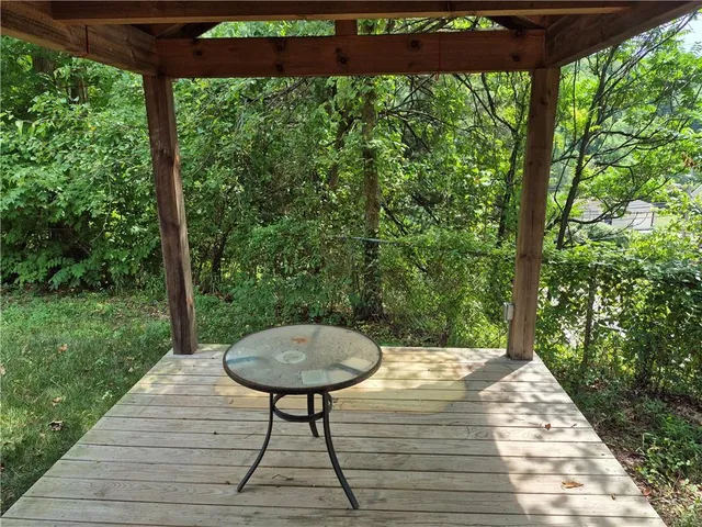 a view of a chairs and table in the garden