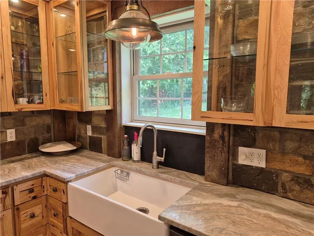 a kitchen with a sink and a window
