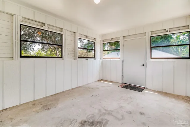 an empty room with windows