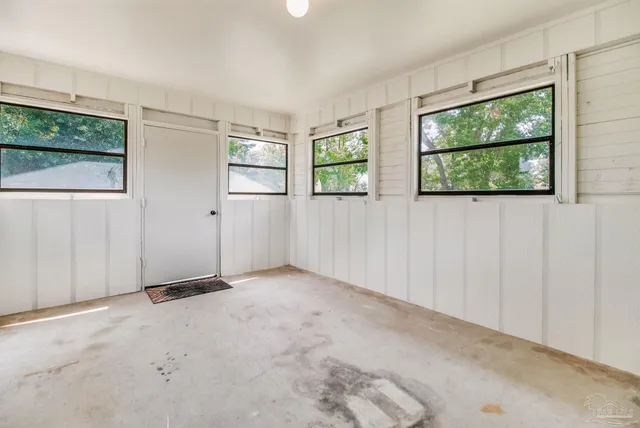 an empty room with windows