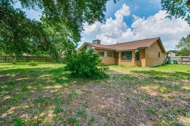 a view of a house with a big yard
