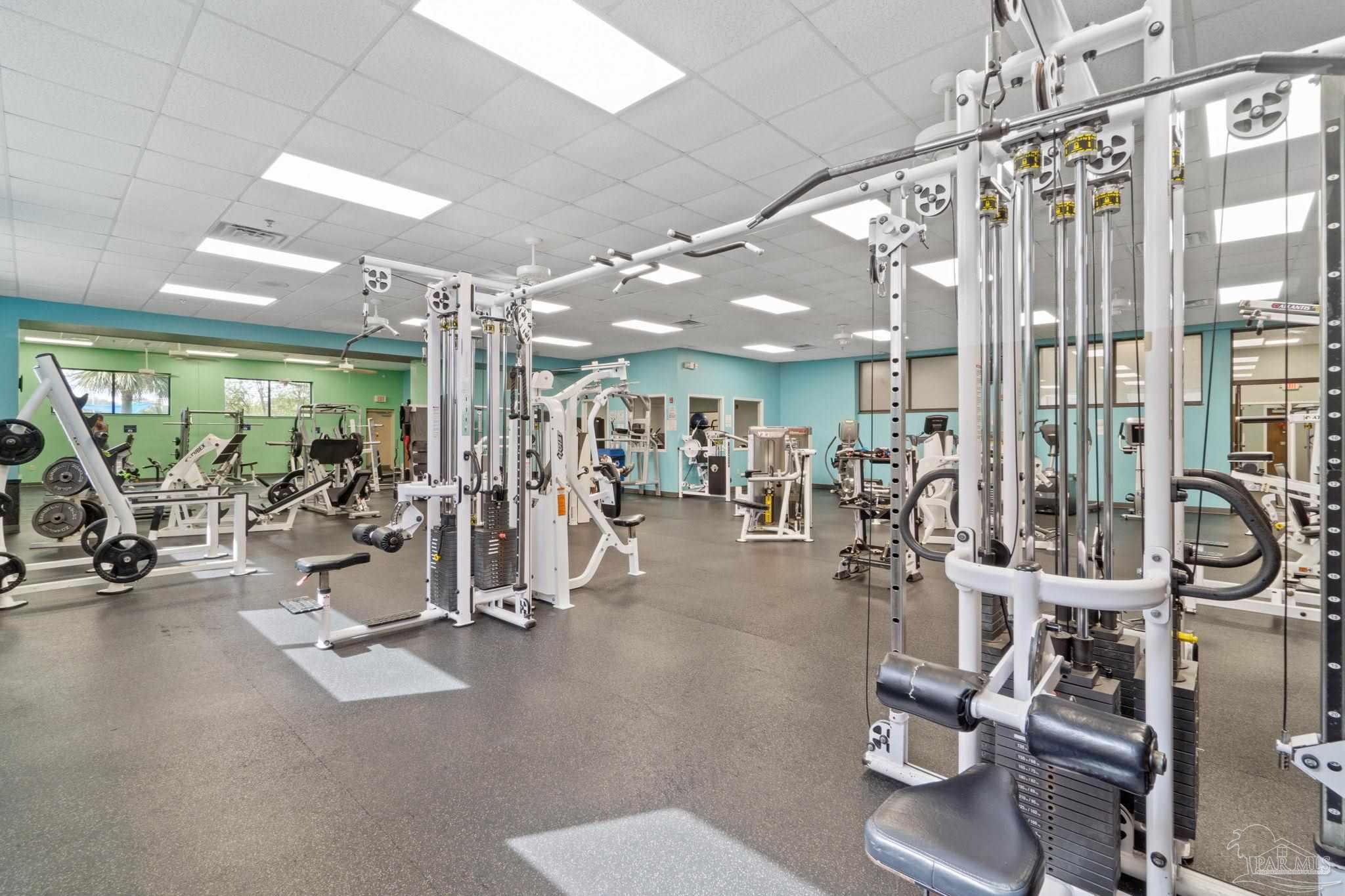 7489 Sandstone Street Navarre, FL 32566 - Photo 42 of 49 a view of a room with gym equipment