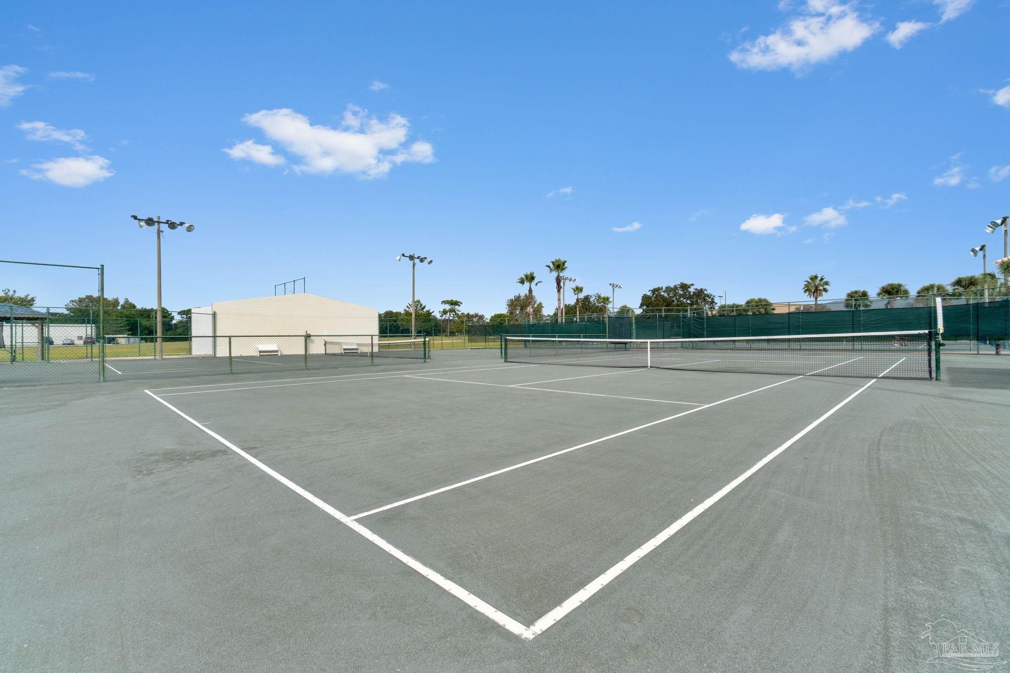 7489 Sandstone Street Navarre, FL 32566 - Photo 46 of 49 a view of a tennis court