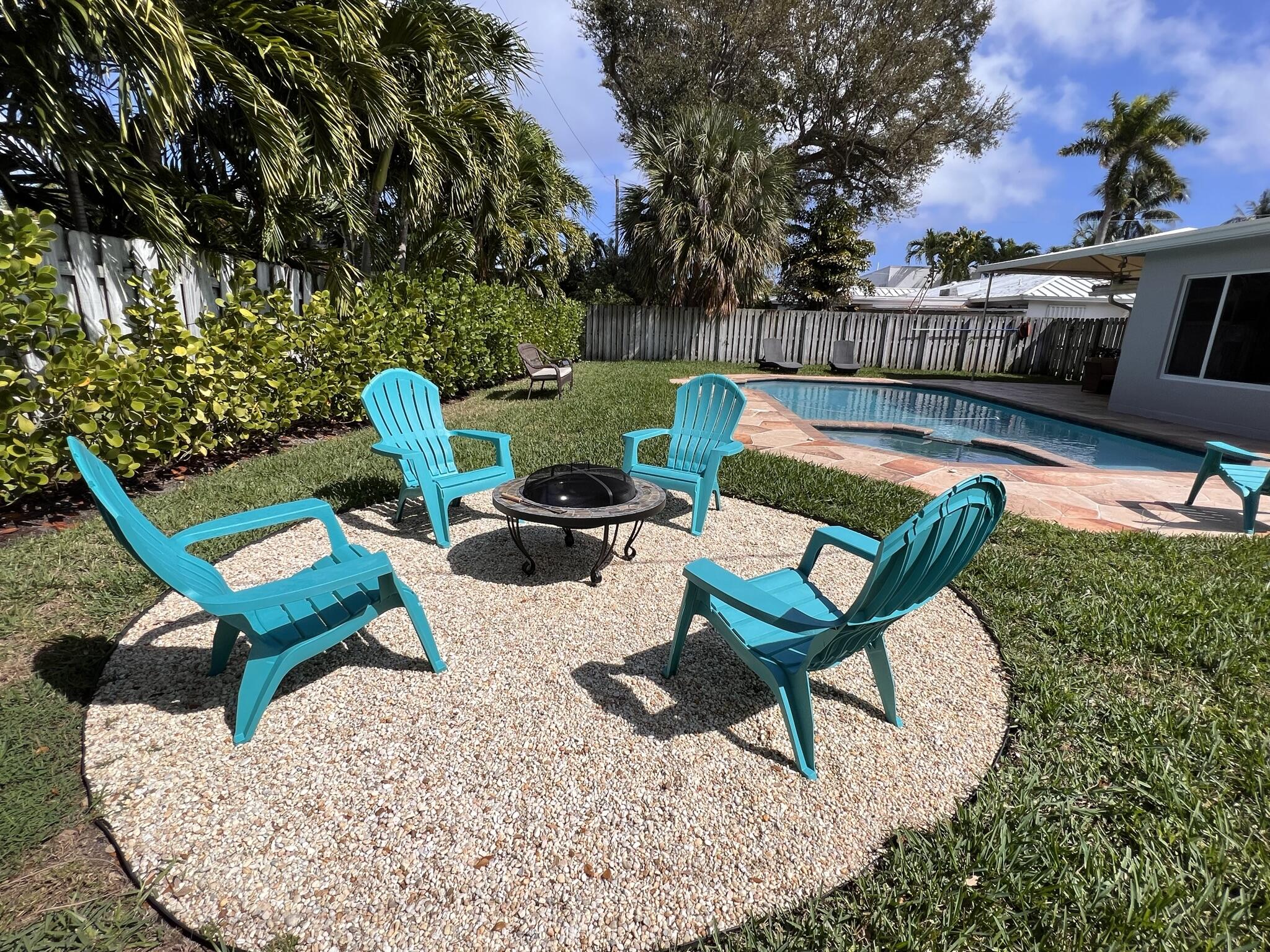 2011 Northeast 31st Street Lighthouse Point, FL 33064 - Photo 35 of 42 Backyard Fire Pit Area