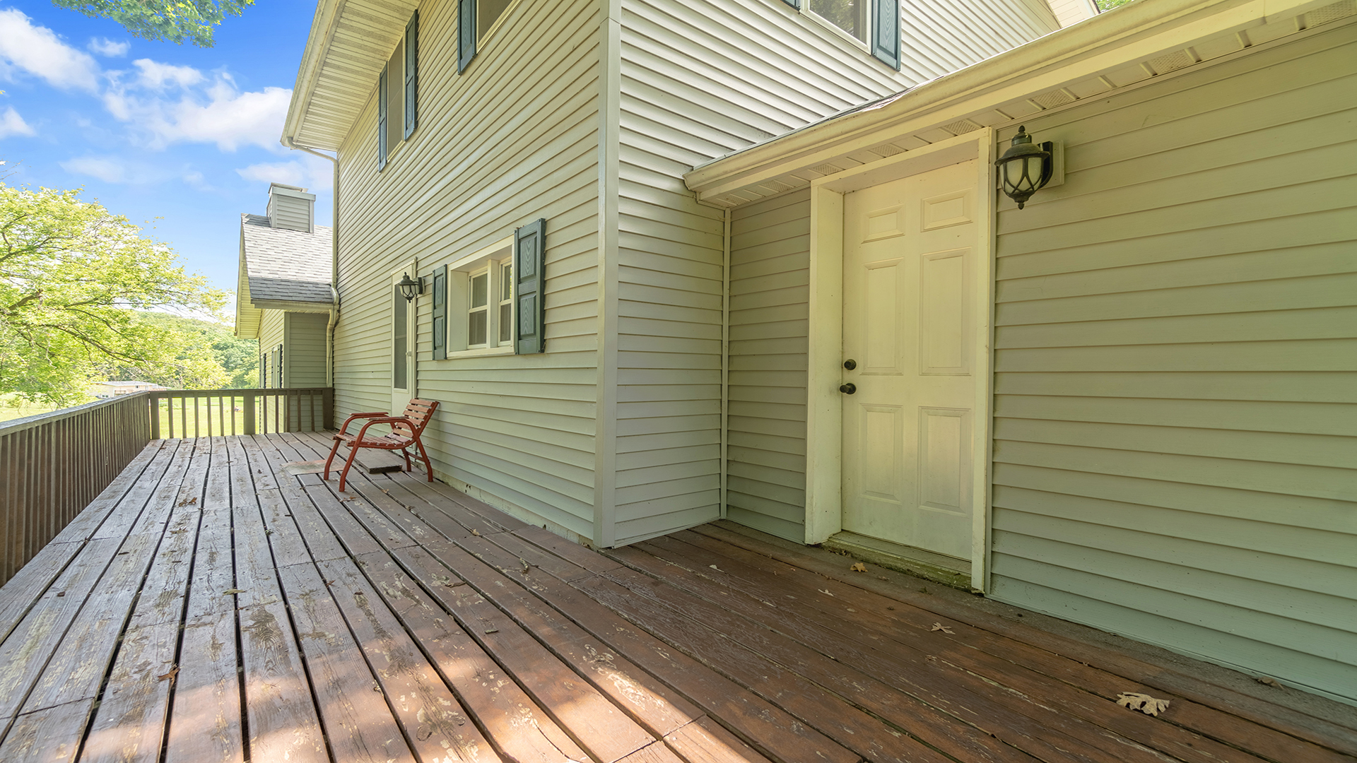 503 West Devils Backbone Road Oregon, IL 61061 - Photo 14 of 46 a view of a balcony with wooden floor and fence
