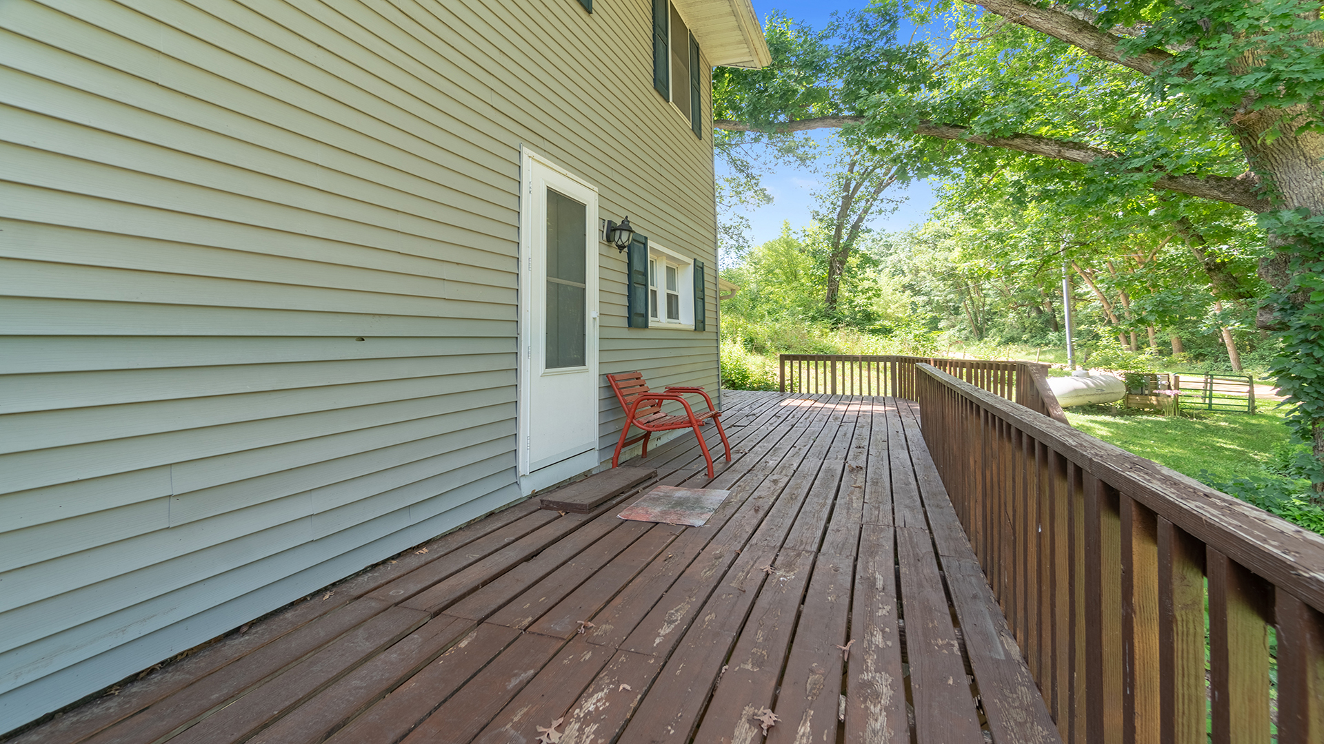 503 West Devils Backbone Road Oregon, IL 61061 - Photo 15 of 46 a view of a wooden deck with a yard