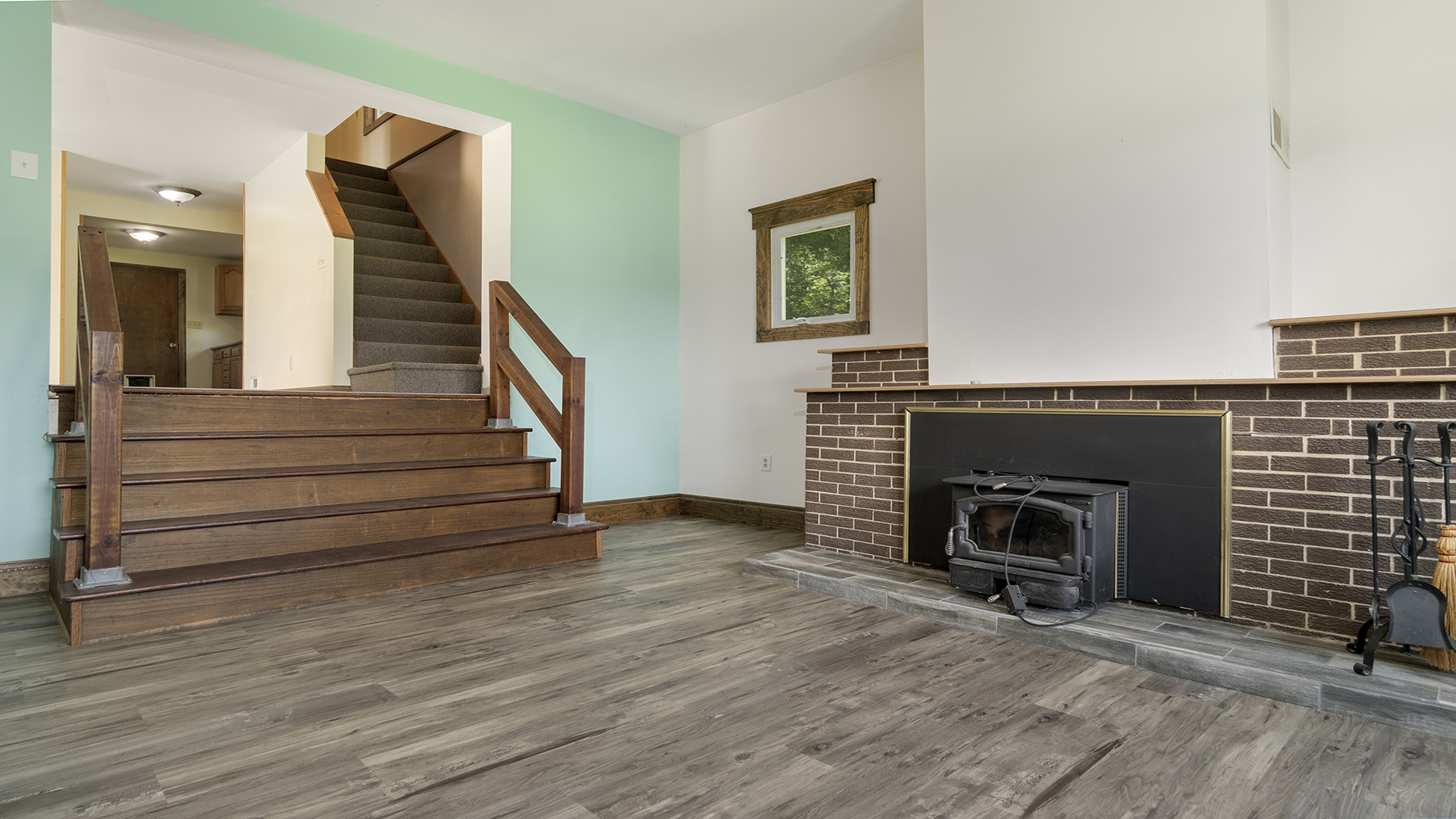503 West Devils Backbone Road Oregon, IL 61061 - Photo 28 of 46 a view of an empty room with wooden floor and a fireplace