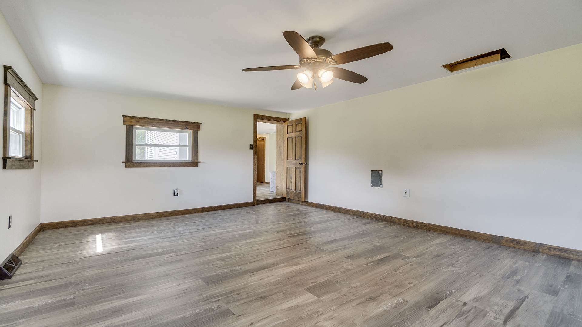 503 West Devils Backbone Road Oregon, IL 61061 - Photo 31 of 46 a view of a big room with wooden floor and windows