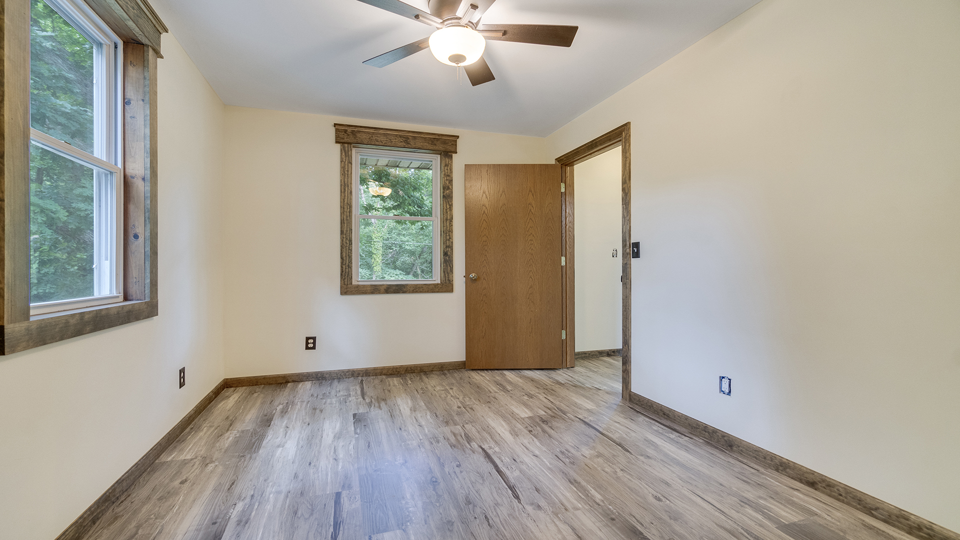 503 West Devils Backbone Road Oregon, IL 61061 - Photo 35 of 46 a view of an empty room with wooden floor and a window