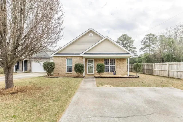 a front view of a house with garden