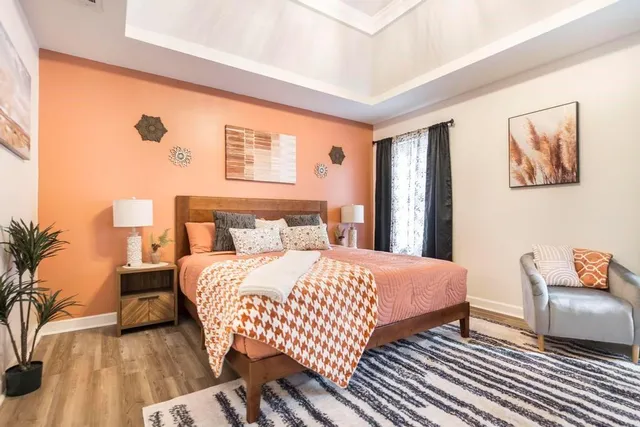 a bedroom with a bed and a couch