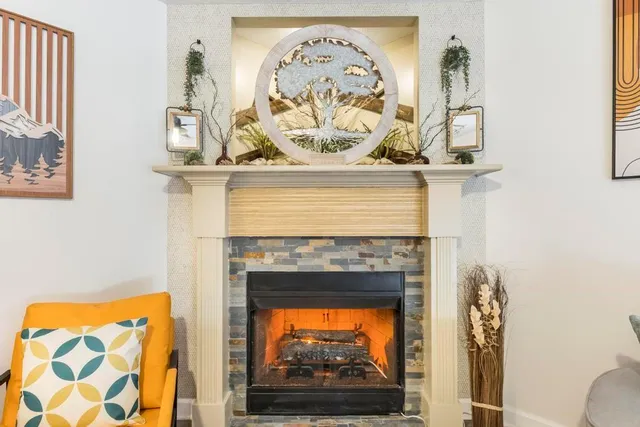 a view of fireplace with wooden floor