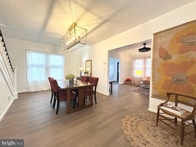 a view of a dining room with furniture and window