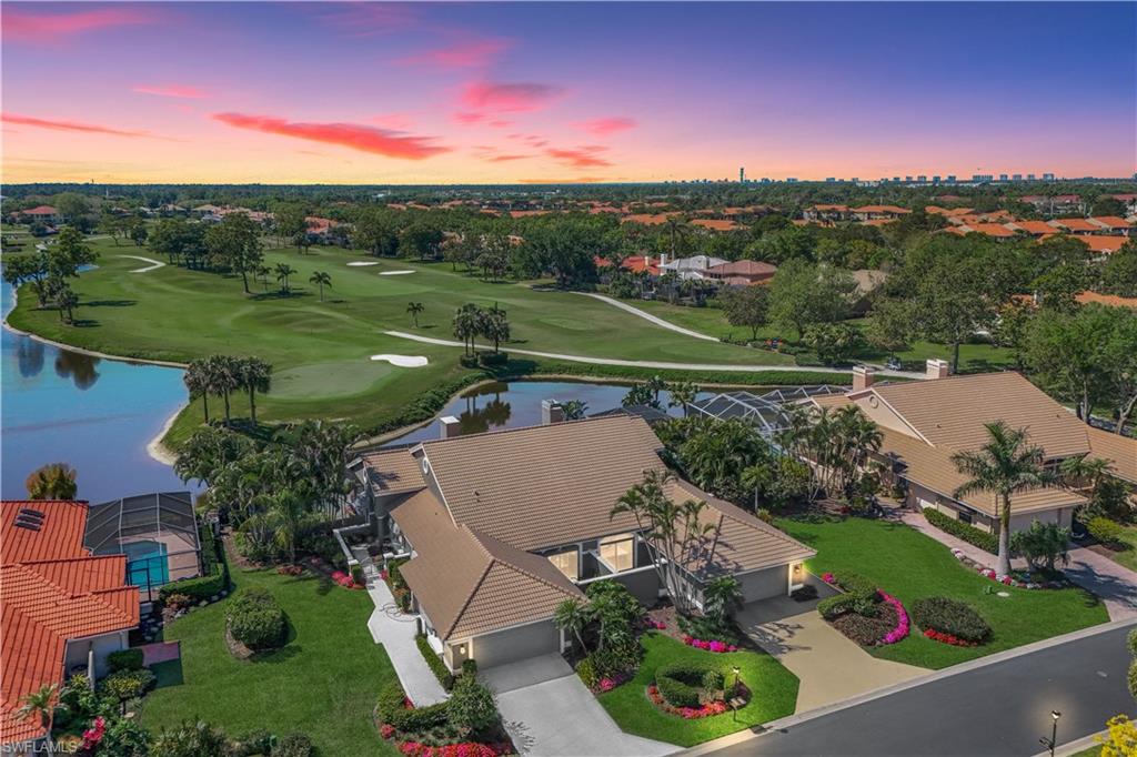 11831 Quail Village Way Naples, FL 34119 - Photo 2 of 32 an aerial view of a house with a garden