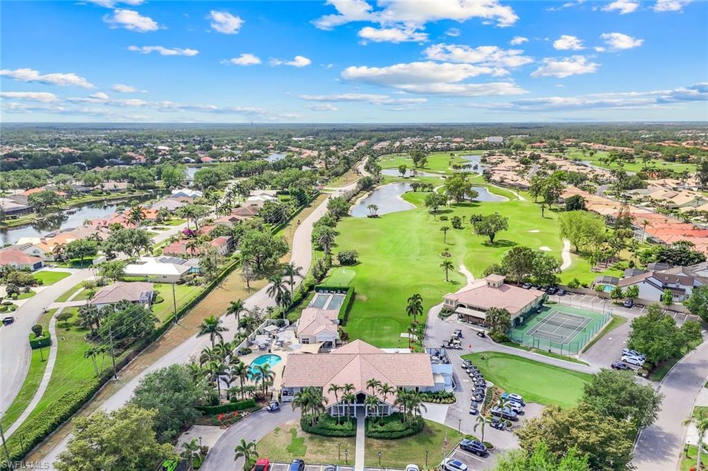 11831 Quail Village Way Naples, FL 34119 - Photo 24 of 32 an aerial view of residential houses with outdoor space