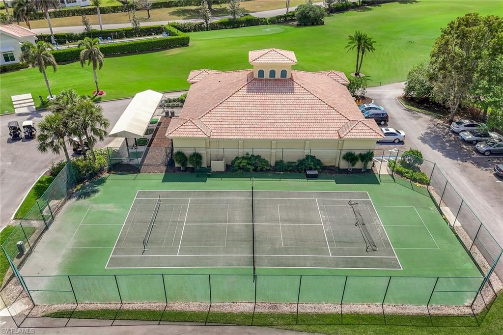 11831 Quail Village Way Naples, FL 34119 - Photo 31 of 32 a view of a house with a big yard