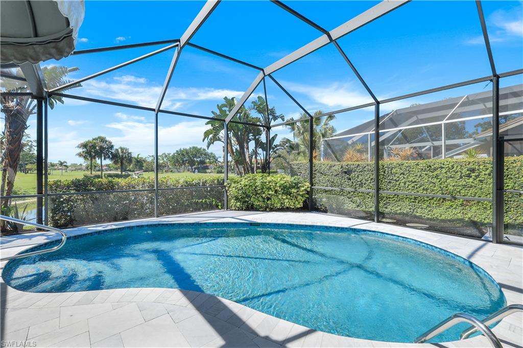 11831 Quail Village Way Naples, FL 34119 - Photo 8 of 32 a view of a backyard