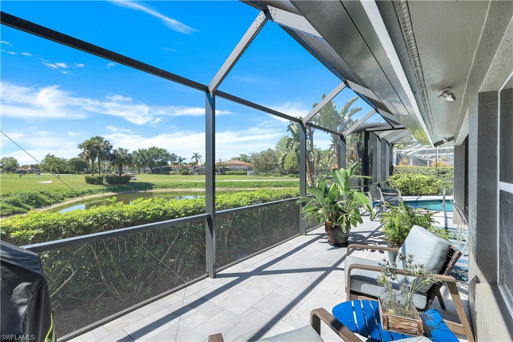 11831 Quail Village Way Naples, FL 34119 - Photo 10 of 32 a view of deck with furniture and garden