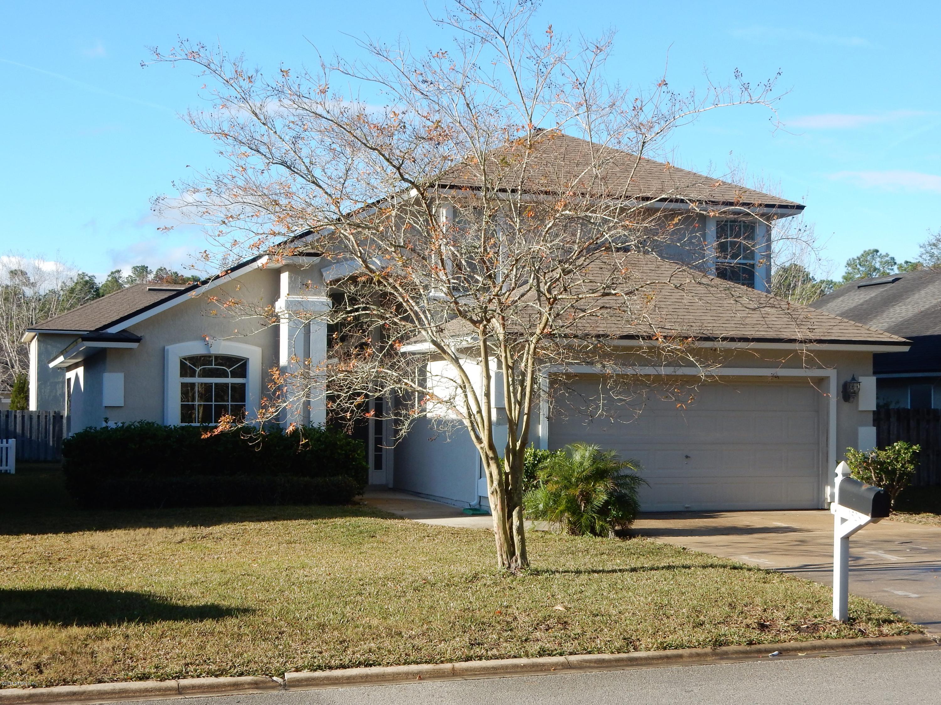 1528 Summerdown Way St. Johns, FL 32259 - Photo 1 of 28 a house that has a tree in front of it