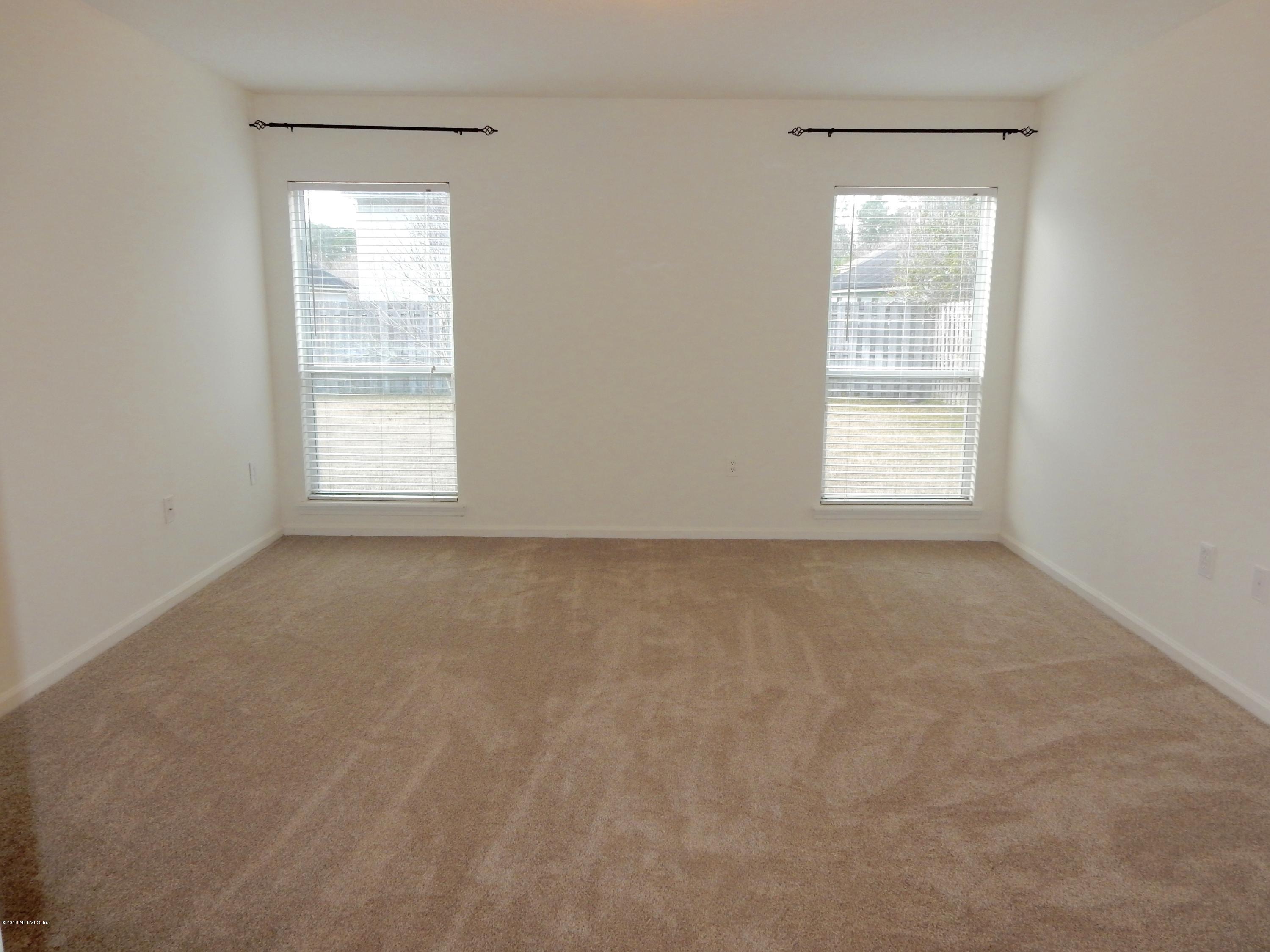 1528 Summerdown Way St. Johns, FL 32259 - Photo 17 of 28 an empty room with a window