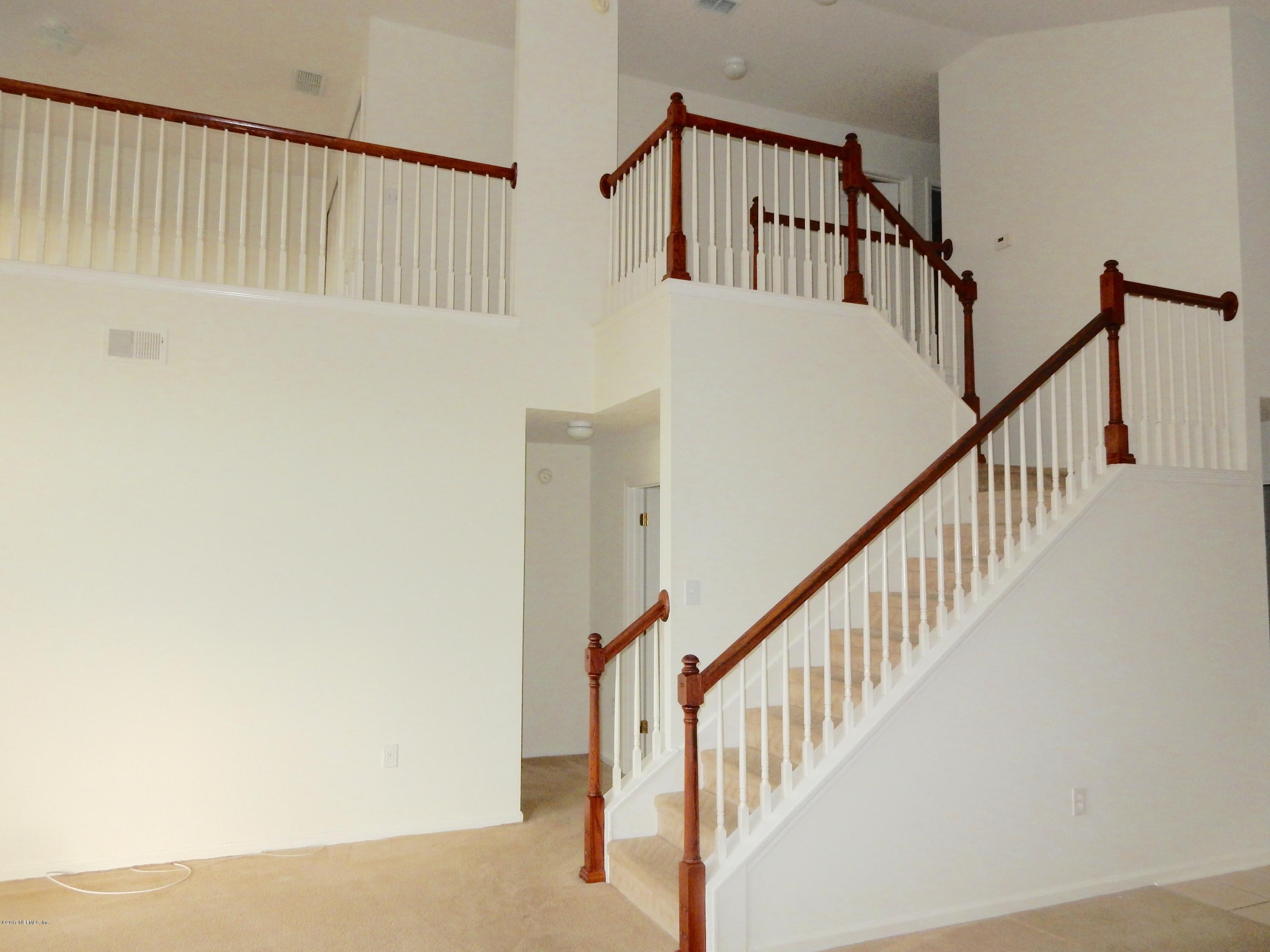 1528 Summerdown Way St. Johns, FL 32259 - Photo 20 of 28 a view of staircase with railing and white walls