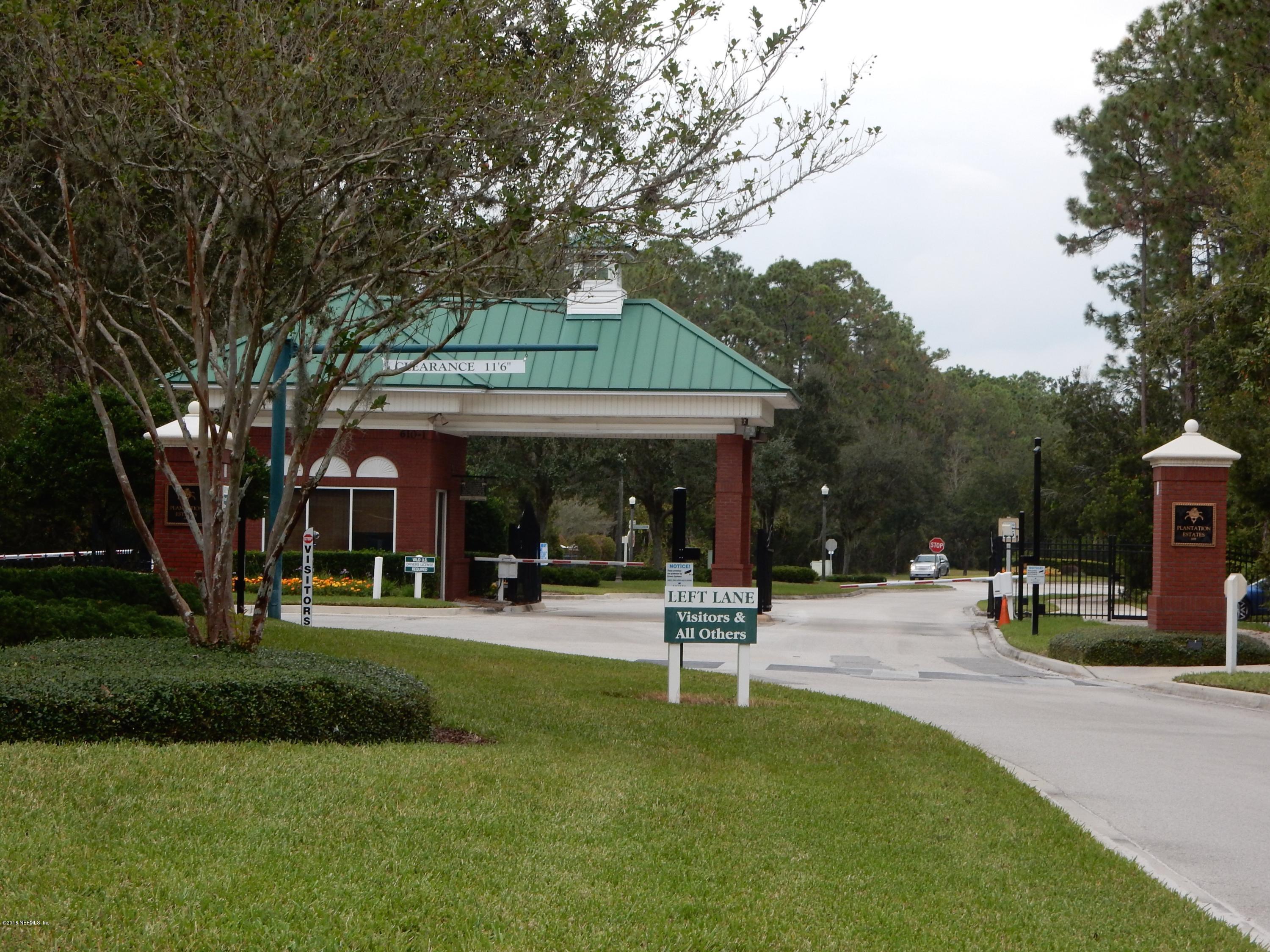 1528 Summerdown Way St. Johns, FL 32259 - Photo 2 of 28 a front view of a house with a garden and trees