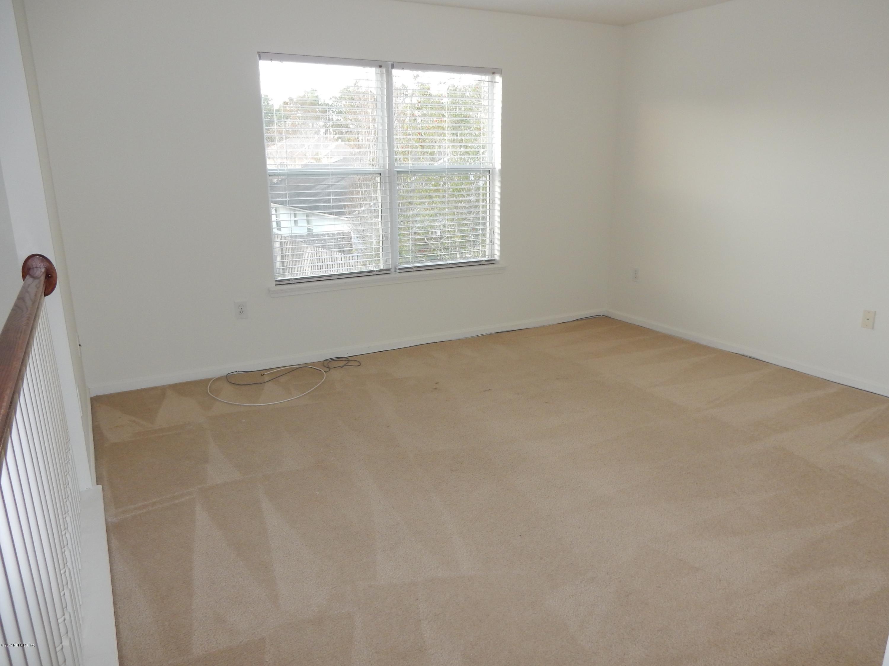 1528 Summerdown Way St. Johns, FL 32259 - Photo 21 of 28 an empty room with a window
