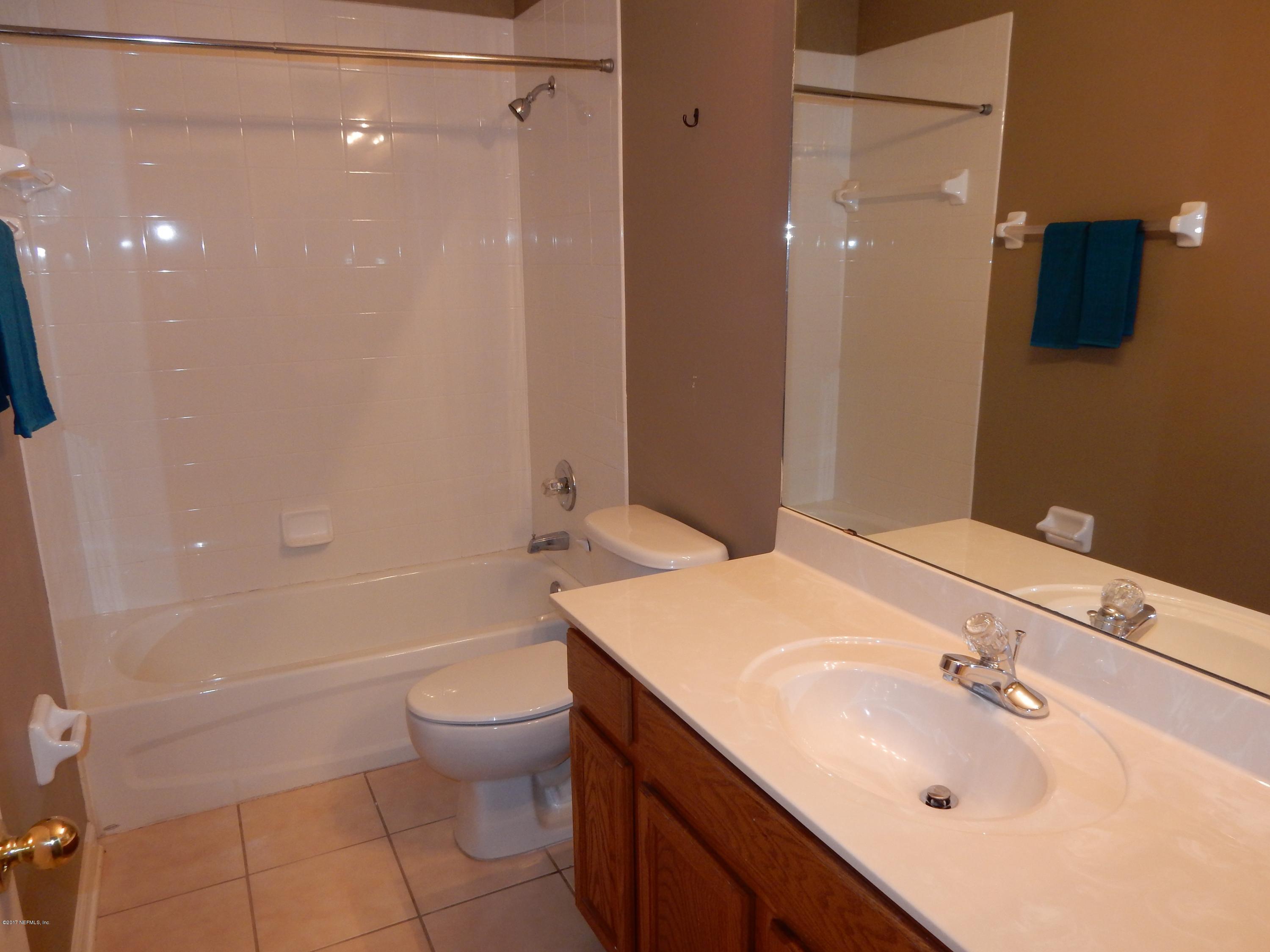 1528 Summerdown Way St. Johns, FL 32259 - Photo 23 of 28 a bathroom with a sink toilet and shower
