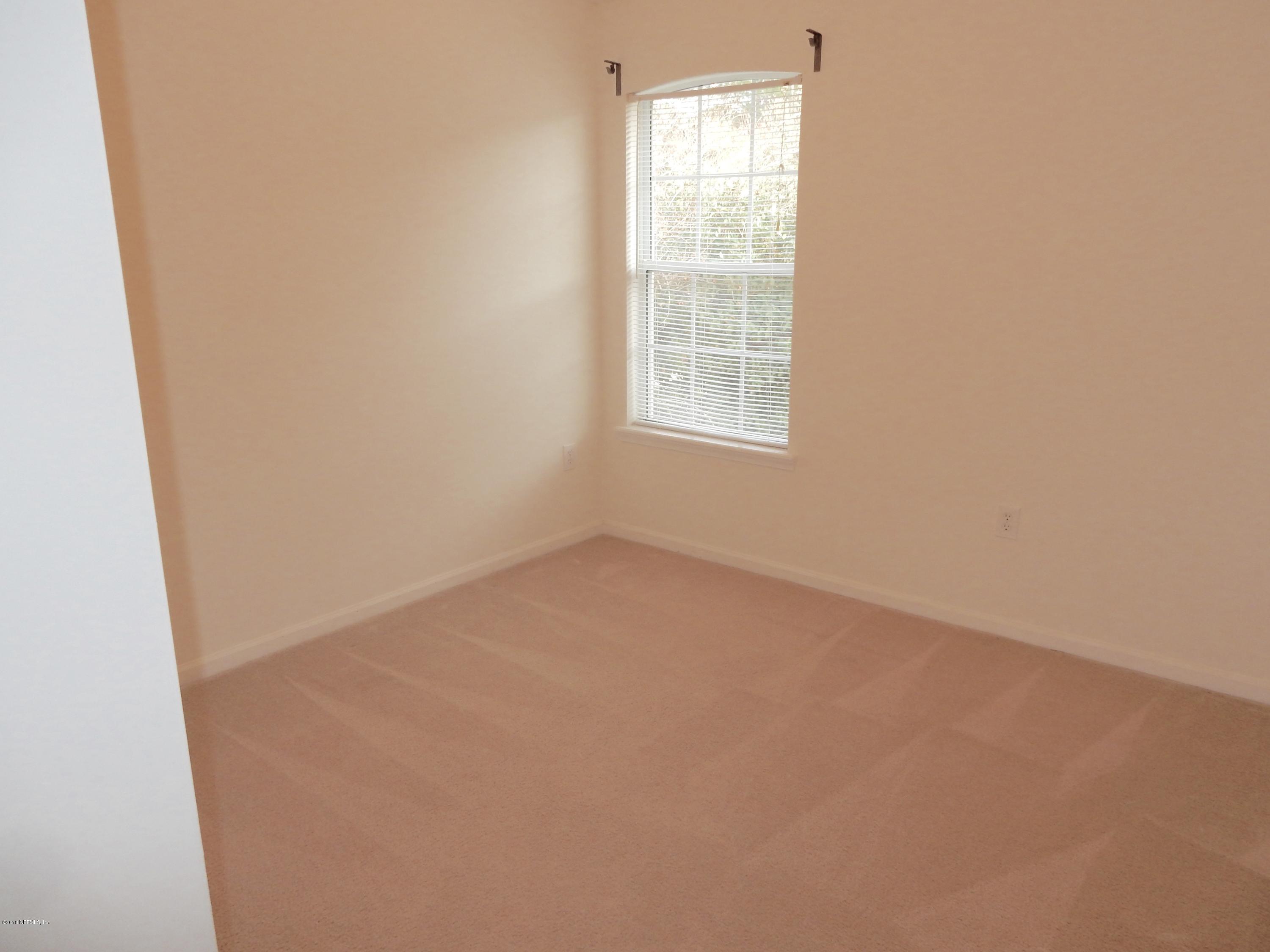 1528 Summerdown Way St. Johns, FL 32259 - Photo 24 of 28 an empty room with a window