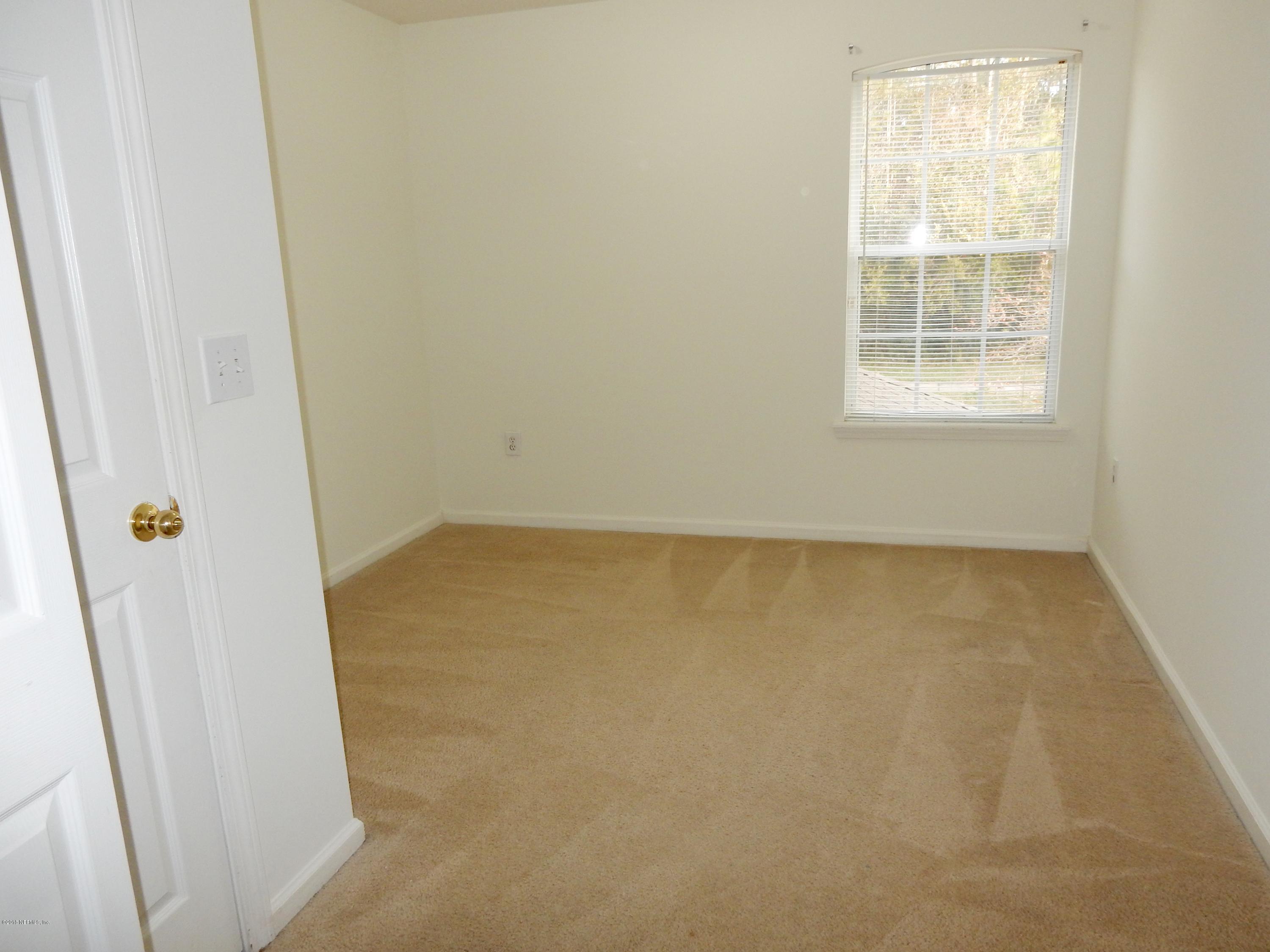 1528 Summerdown Way St. Johns, FL 32259 - Photo 25 of 28 an empty room with a window
