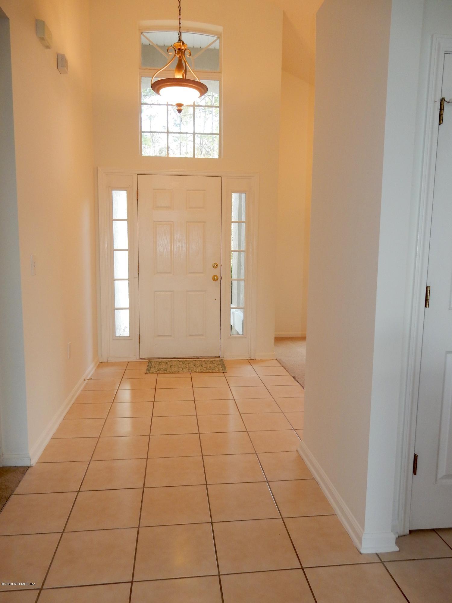 1528 Summerdown Way St. Johns, FL 32259 - Photo 4 of 28 an empty room with windows and entrance