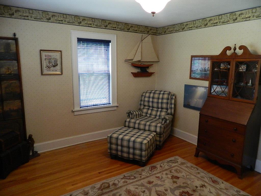 4619 Spring Brook Road Rockford, IL 61114 - Photo 17 of 32 a living room with furniture and a wooden floor